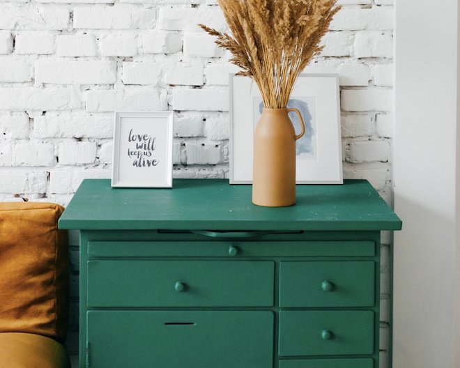 A green desk with some decorations